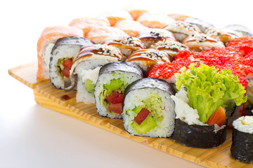 Sushi set on wooden plate