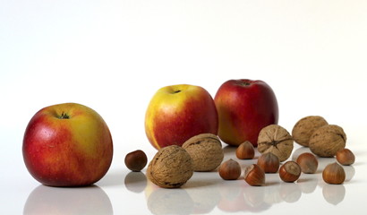 Group of apples fruits and nuts.