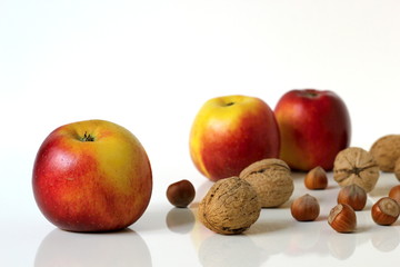 Apples fruits and nuts.