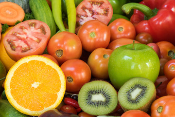 Naklejka na ściany i meble Close-up orange slice with vegetables