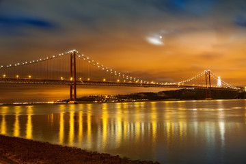 Fototapeta na wymiar 25 de Abril bridge over Tagus river in Lisbon at night