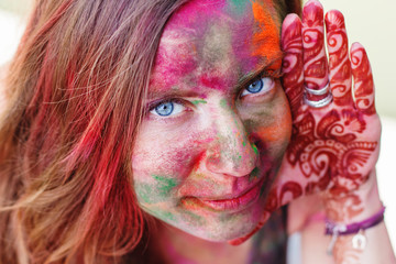 Portrait of girl with colorful paint on her face