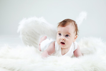 Portrait of a young child dressed in an angel