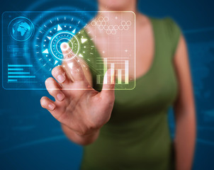 Woman pressing high tech type of modern buttons