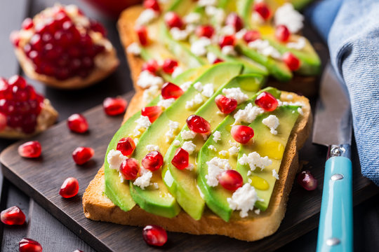 Avocado sandwich with feta and pomegranate