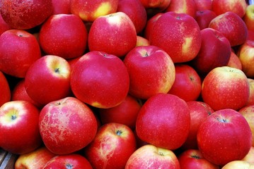 Fresh red ripe apples background