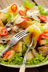 Salad Caesar with mushrooms, eggs, chili and radish with two for