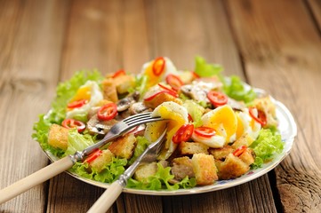 Salad Caesar with mushrooms, eggs, chili and radish with two for