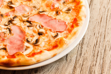 pizza on wooden background