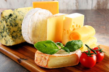 Different sorts of cheese on kitchen table