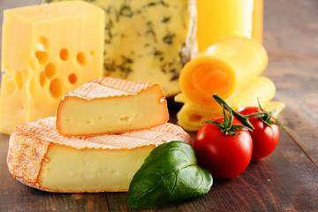 Different sorts of cheese isolated on kitchen table
