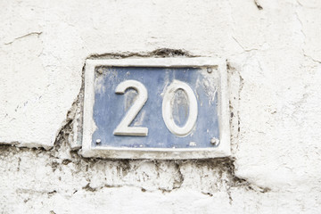 Number twenty on the wall of a house