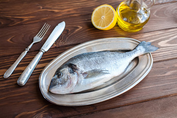 Raw dorado on the plate