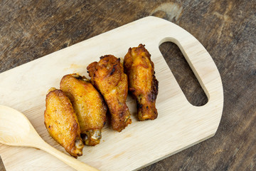 Chicken wings on wood board