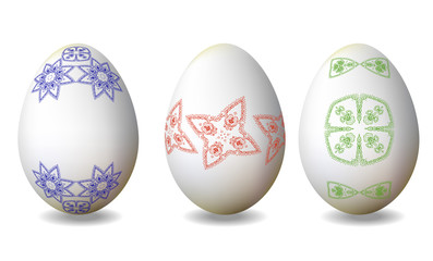 Three Easter eggs with hand drawn blue, red and green pattern