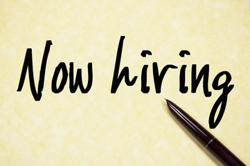 now hiring text write on paper
