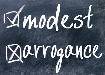 Fototapeta premium modest and arrogance sign on blackboard