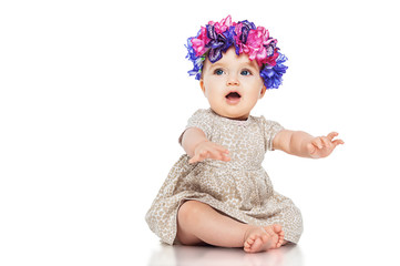 Beautiful little girl wearing a wreath