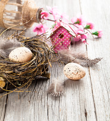 Obraz na płótnie Canvas quail eggs on white wooden background