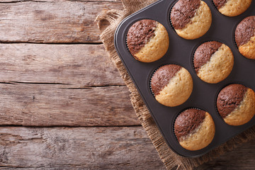 hot colorful cupcakes in a baking dish. horizontal top view