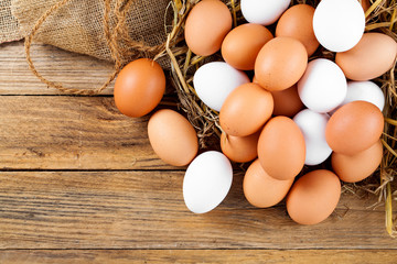 quail eggs on white wooden background