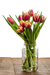 Bouquet of tulips in a mason jar