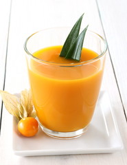 Yellow, fruity mango smoothie made from ripe fruit