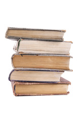 stack of old books on a white background