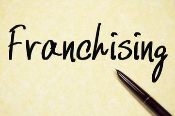 franchising word write on paper