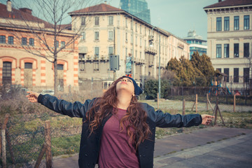 Beautiful girl posing in an urban context