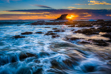 Waves and rocks at sunset, at Little Corona Beach, in Corona del