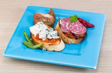 Tapas with cheese and salami