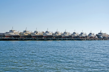 Fototapeta premium Pleasure boats on the pier in Yalta