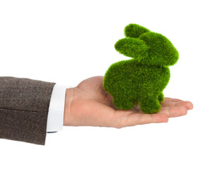 Rabbit made of grass in hand