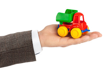 Fototapeta premium Toy car truck in hand