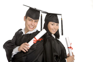 Two smiling graduates at the white background