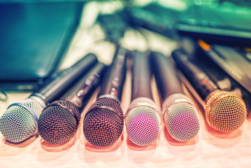 collection of microphones and dj equipement at a concert