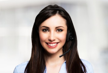 Smiling woman using an headset