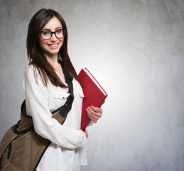 Young woman holding a book