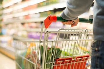 Foto op Plexiglas Detail of a man shopping in a supermarket © Minerva Studio