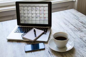 Checking monthly activities in the calendar in the laptop