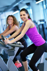 Group of people running on treadmills