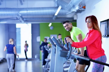 Fototapeta premium Group of people running on treadmills