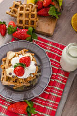 Belgian waffles with chocolate chips and fruits