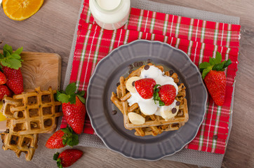 Belgian waffles with chocolate chips and fruits