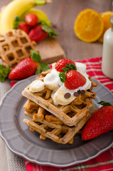 Belgian waffles with chocolate chips and fruits