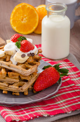 Belgian waffles with chocolate chips and fruits