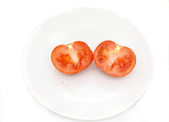 Sliced tomato on the plate.