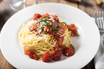 Plate of homemade pasta Spaghetti with tomato sauce