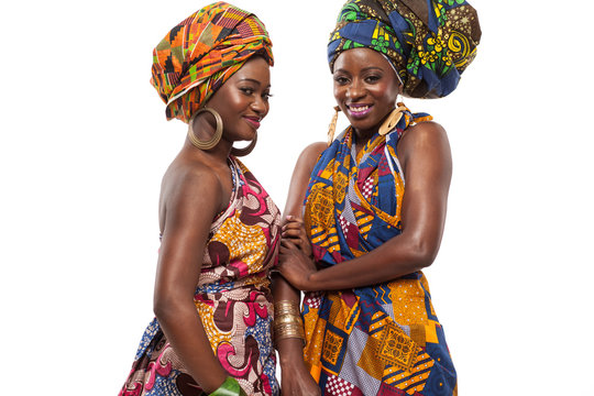 African female models posing in dresses.